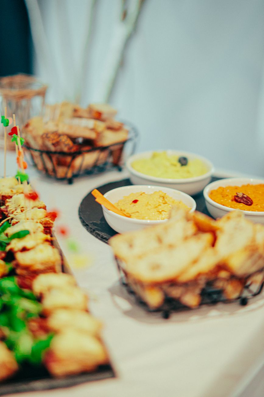 Friends gathered around a Party Dipper platter at a celebration