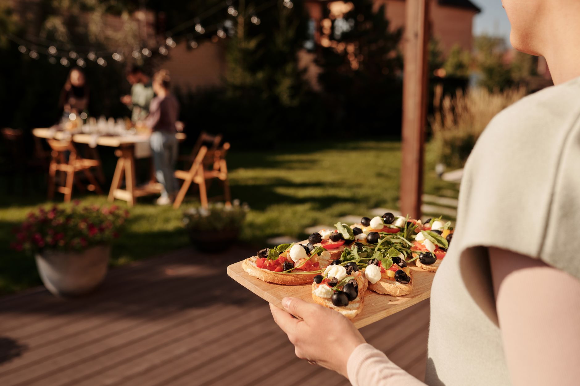 A colorful party platter loaded with dips and appetizers